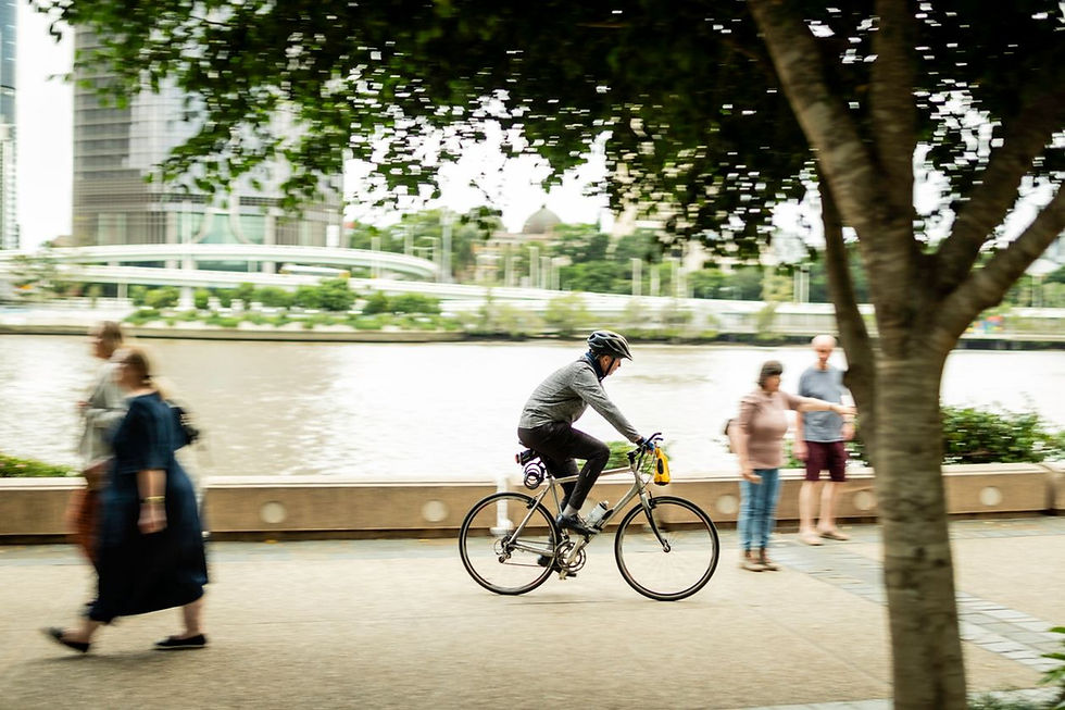 Cyclist riding along the riverside walkway in Brisbane, Queensland, Australia
