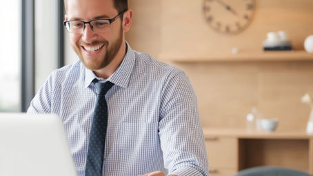 professional accountant advising a client on whether it is worth using an accountant for tax return in Australia with documents and laptop