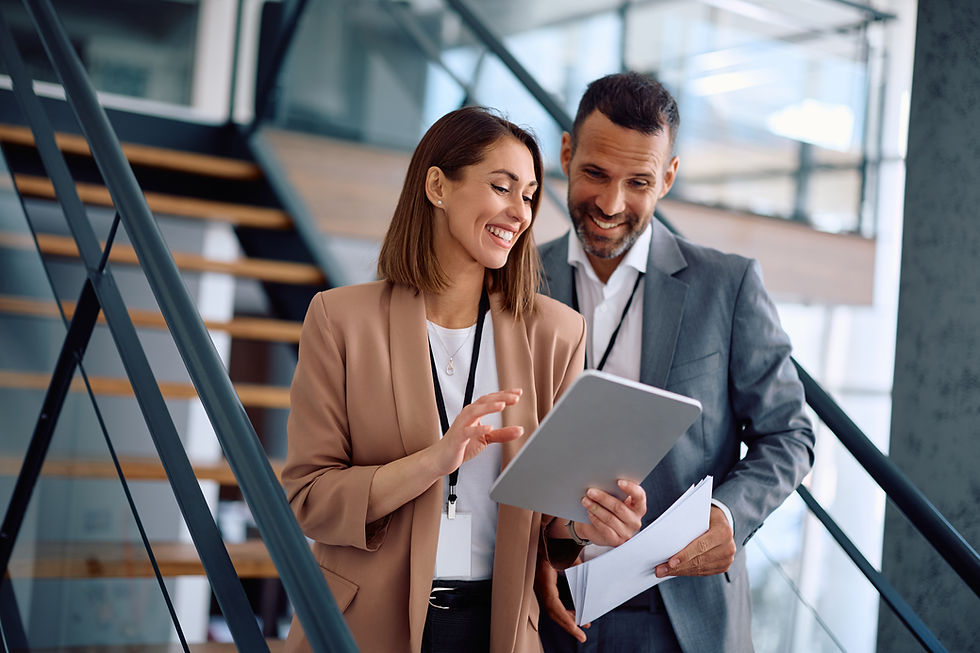 happy-businesswoman-her-colleague-working-digital-tablet-office.jpg
