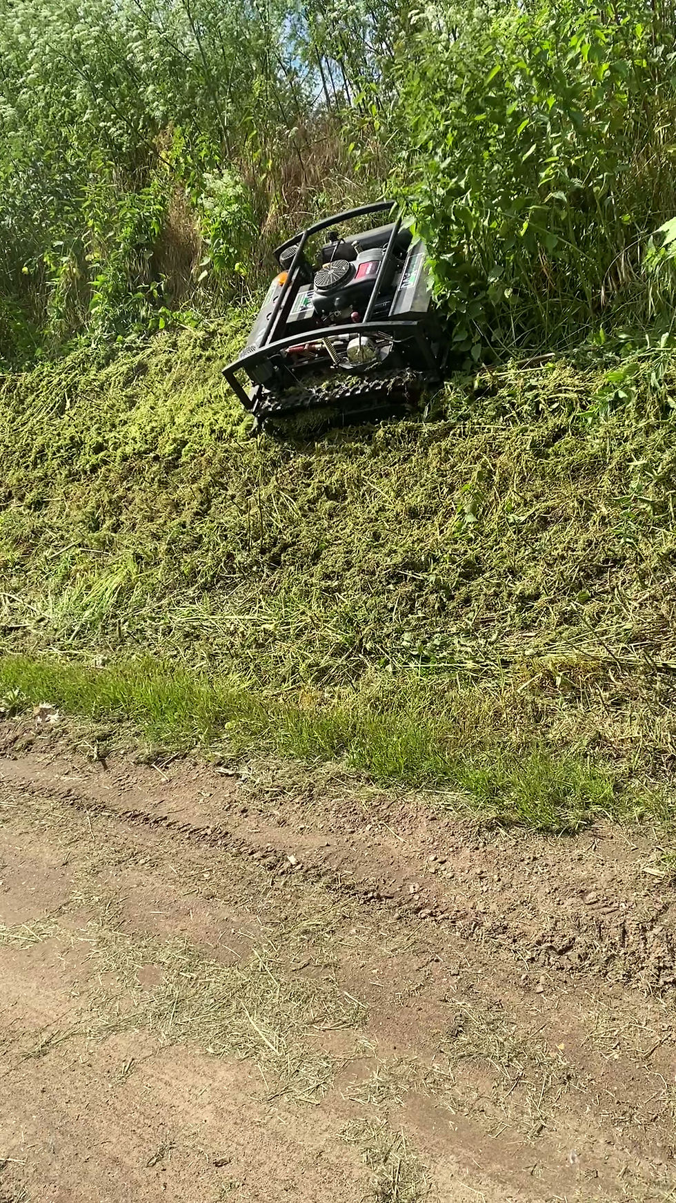 Thumbnail: Dax RC900 operating on steep slope embankment bank 45 degrees