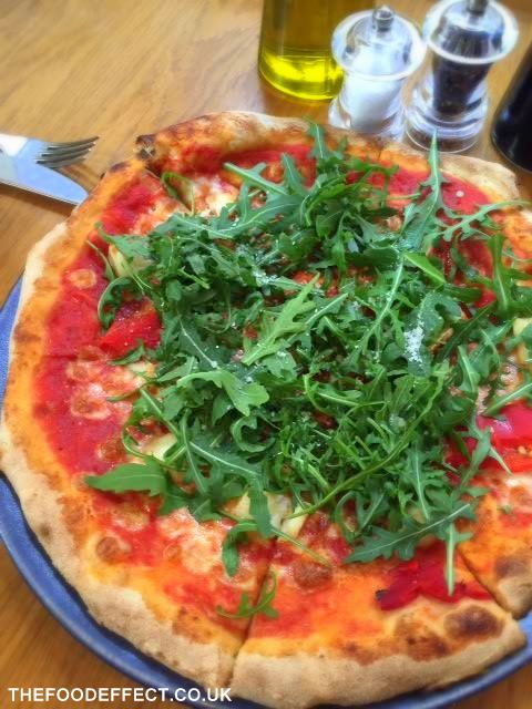Thin crust pizza loaded with salad greens... Food Effect perfection!