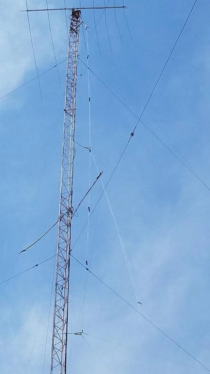 A photo of the conrtol box unit at K0UO, this antenna is fixed at 30 degrees from Kansas, but steerable, plus or minus 30° using electronic phasing, a total of 90°. The upper Array is at about 190 feet, the lower Array is at 100 feet. This antenna is designed with steerable directivity and wave angle phasing. The main area of interest for this antenna is Northern to Southern Europe, over the north pole to Western Asia, south to the Mediterranean, Northern Africa and the Mideast. 20 db of gain on HF ham bands Historic Preservation: The K0UO station diligently preserves and uses components and insulators from renowned, historic radio arrays, including those from W6AM (Don Wallace), W7YRV Roy, BBC, Voice of America (VOA), and many others.
"The K0UO station is unlike any other ham station globally," making it truly unique as a Big Gun Mega Station. It is one of the few capable of constructing and utilizing very large Rhombic and V Beams, along with a variety of other antennas and AI. K0UO features the largest operational HF wire antenna in the world.