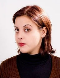 short-haired woman with eyebrow raised