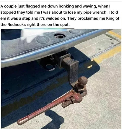 pipe wrench welded to the back of a truck
