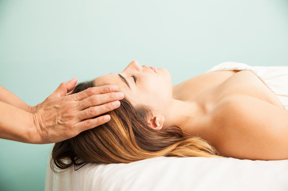 profile-view-cute-young-woman-getting-her-energy-balanced-reiki-session-health-clinic-spa.