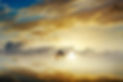 Silhouetted couple at sunset, misty clouds