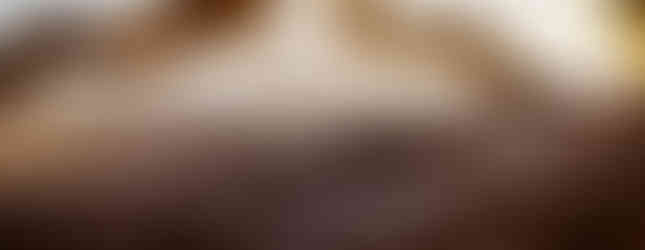 Couple walking towards beach wedding arch Marival Armony Punta de Mita