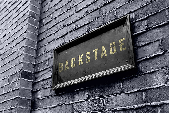 Backstage hanging signage wooden board. Business owner puts a golden black backstage sign..jpg