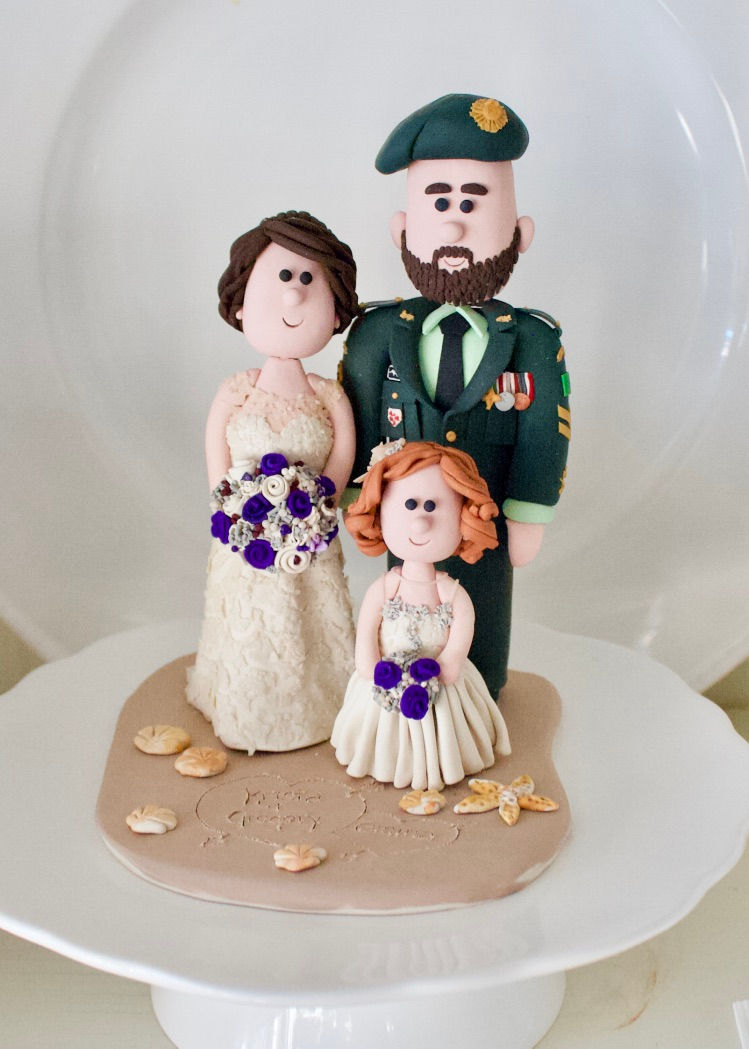 bride and groom on beach wedding cake topper