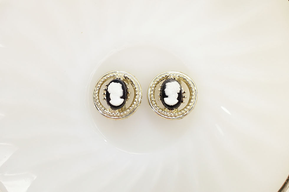 Round hollow out black cameo clip on earrings