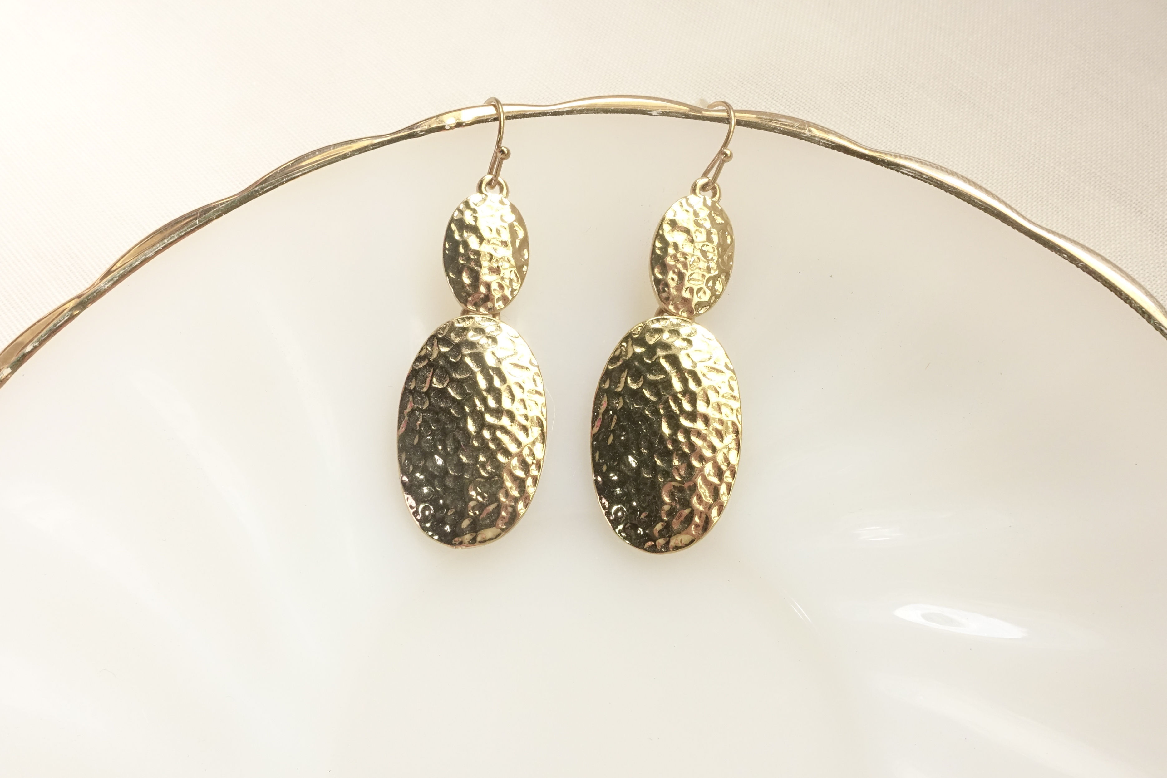 Double oval textured surface golden dangle earrings