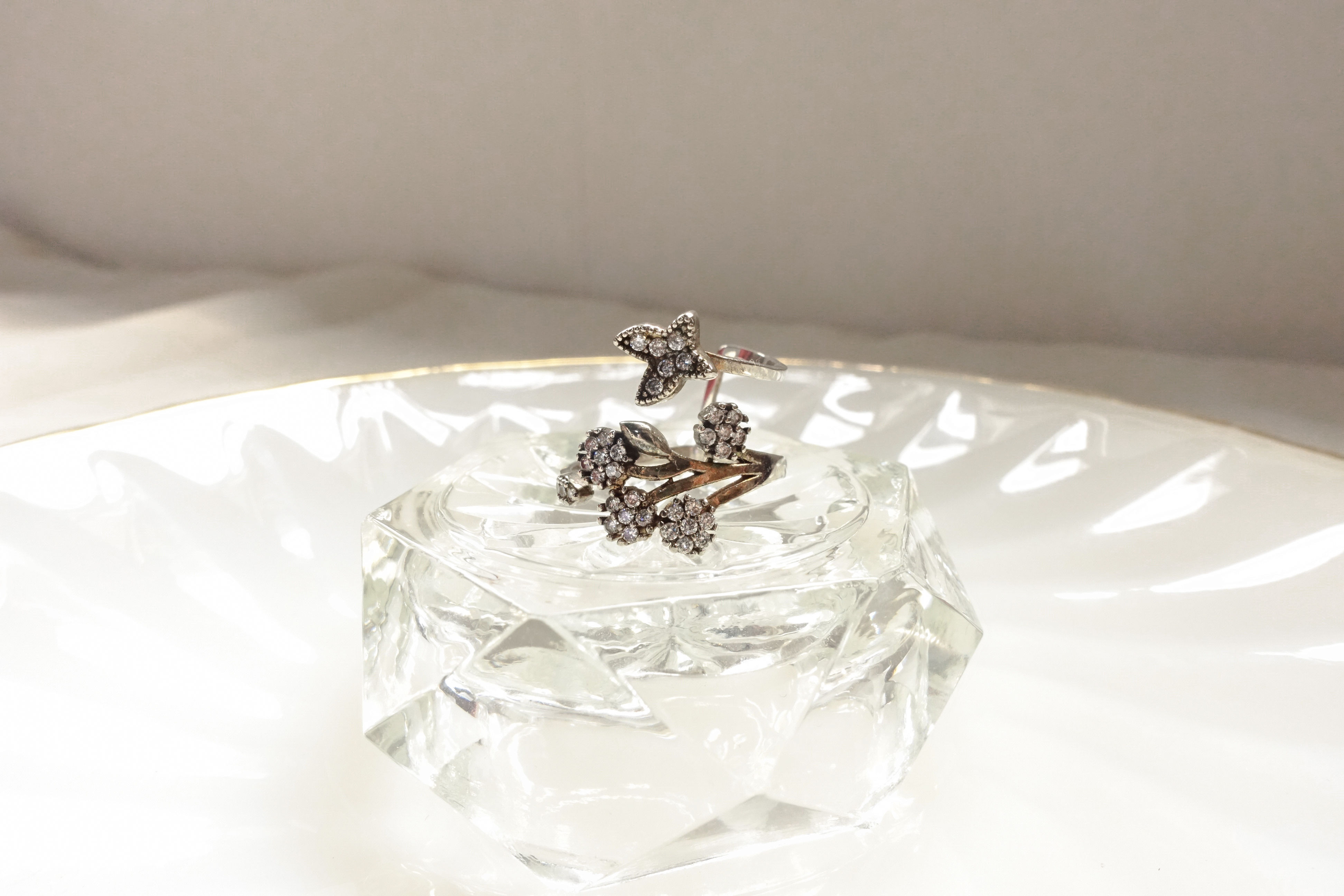 Butterfly on blossom rhinestone silver tone ring