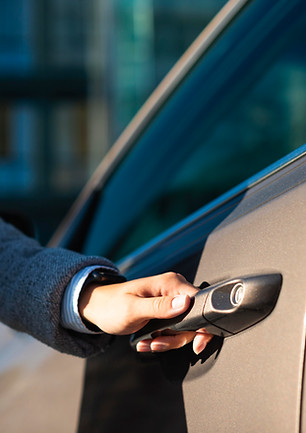 businesswoman-opening-her-car-door.jpg
