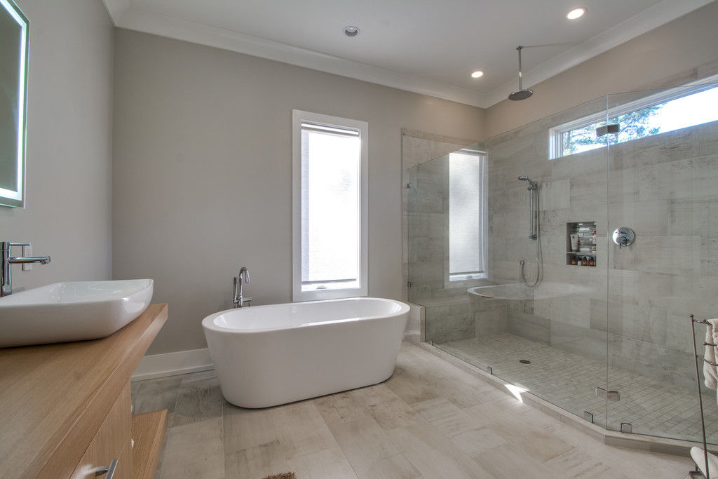 Custom transparent glass shower enclosure by Casali Group, tailored to fit luxury bathrooms with precision and elegance