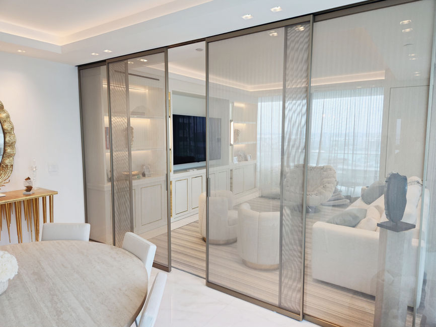 Casali Sliding Lux mesh glass door system featuring a sleek modern design with metallic mesh detail and seamless sliding functionality—perfect for high-end interiors.