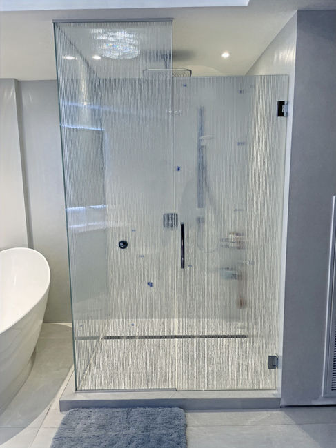 Luxury bathroom enclosures in St. Regis Bal Harbour apartment crafted from premium Casali glass for a sleek, refined look