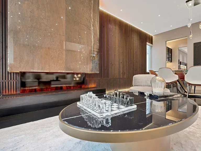 Chicago luxury residence featuring Casali custom glass railing with Lux champagne mesh, satin mocha Line interior doors, bathroom enclosures, and a bespoke Velluto Vase—showcasing Italian elegance and craftsmanship throughout.