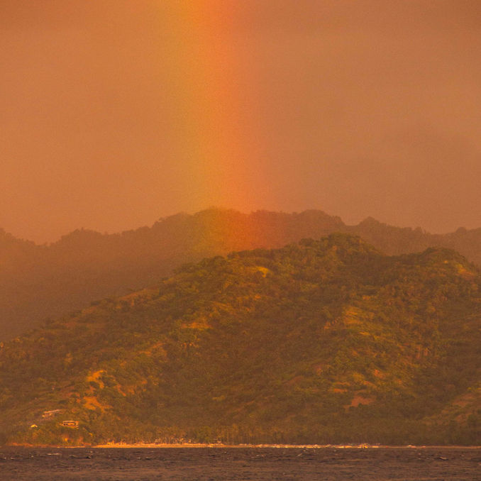 rainbow over the sea and mountains in gili trawangan lombok