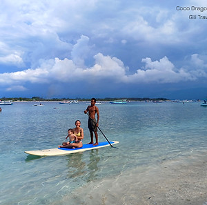 family doing sup stand up paddle in gili