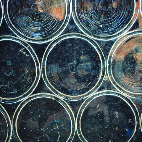 A wall made by the bottoms of glass bottles in Frederick, Maryland taken by Photographer Tom Prather of The Blue Wave Video Production Agency