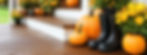 Custom fall porch design with layered pumpkins and colorful mums by Pumpkin City Porches