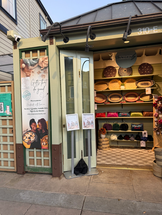 Small market selling handmade baskets, purses, and other crafts.