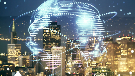 abstract photo of a globe in front of a night skyline