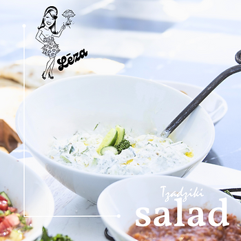 A white bowl featuring tzadziki salad