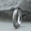 Thumbnail: Handcrafted slim tantalum wedding band for ladies, featuring a brushed matte finish