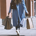 A person carrying shopping bags