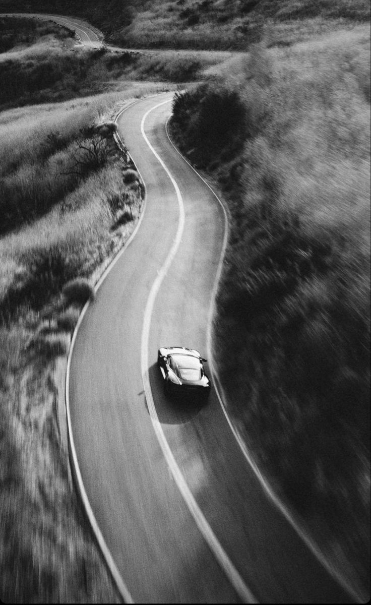 Car driving on an empty road