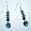 Thumbnail: Dangly teal heart glass bead earrings