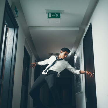 man-break-dancing-on-hallway-1450116.jpg