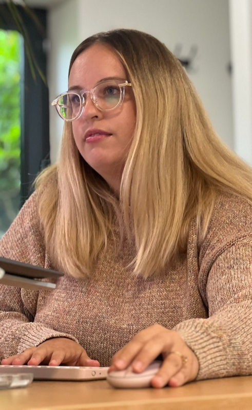 R weber working at her computer