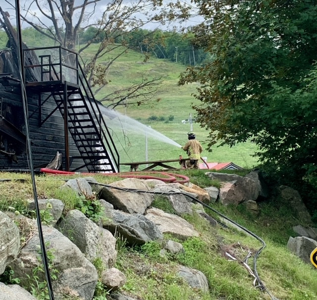 The main lodge of Mont Cascades in Cantley burned down on the morning of Aug. 1. The flames towered out of the structure, and the smoke plume could be seen from across the Gatineau River. Photo courtesy James Labonte