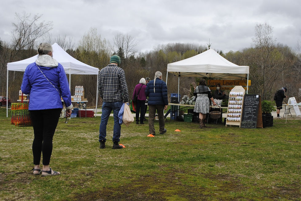 People at the Wakefield Market stood two metres apart outside the Centre Wakefield-La Pêche in May 2020. This year, the vaccination clinic in the community centre has forced the market organizers to find another place to hold the weekly market. Low Down file photo
