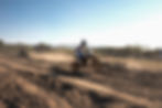 Motocross rider jumping on a dirt track