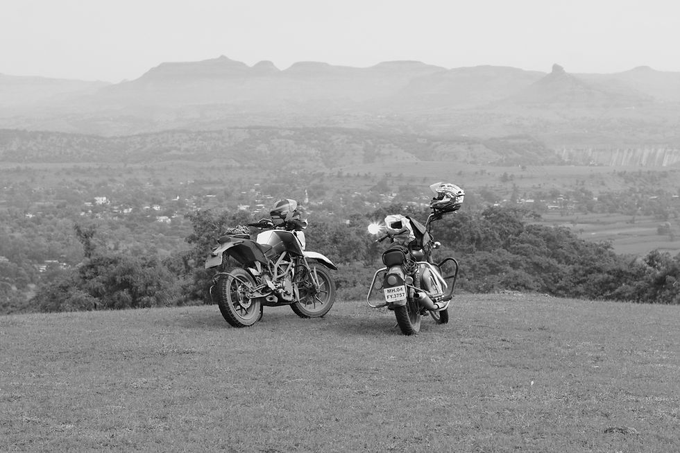 Two Motorcycles on a green Mountain Top near Bhandardhara, Maharastra.