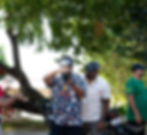 Photographer documenting an automotive event outdoors