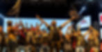Bikers on stage, some with beards, making rock-on gestures