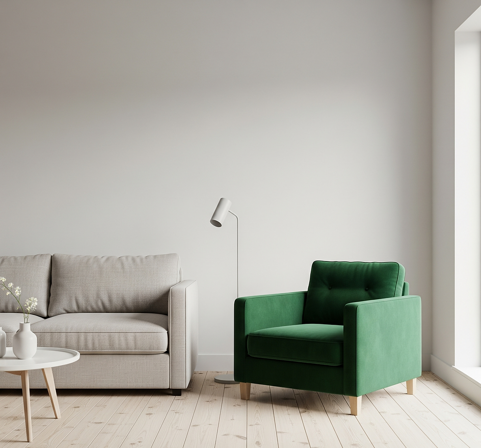 Modern living room with a beige sofa, green armchair, white lamp, and round table with vases. Light wooden floor and neutral walls.