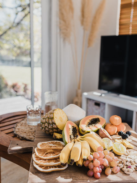 Tropical fruit platter: pineapple, papaya, banana, grapes