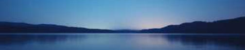Rising sun over water