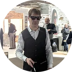 Matteo is wearing TAMI smart glasses and walking in a large indoor hall.