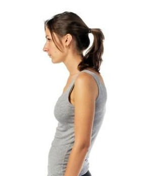 A profile view of a woman standing