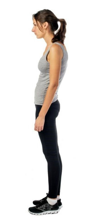A profile view of a woman standing