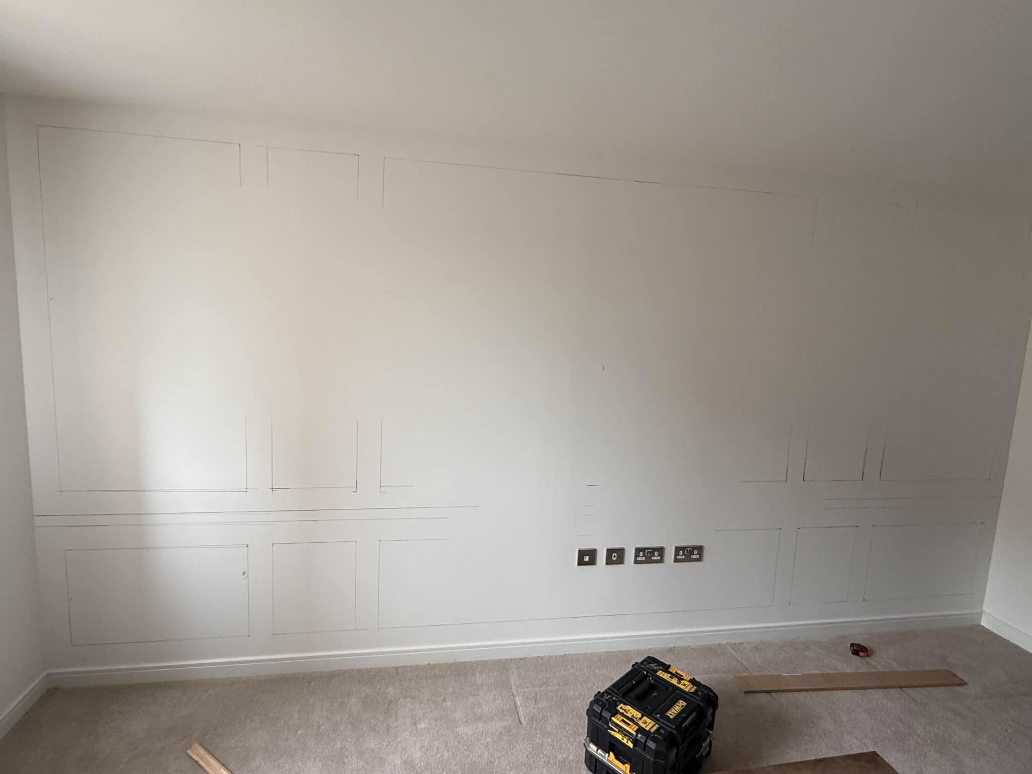 Measured layout marked on the wall