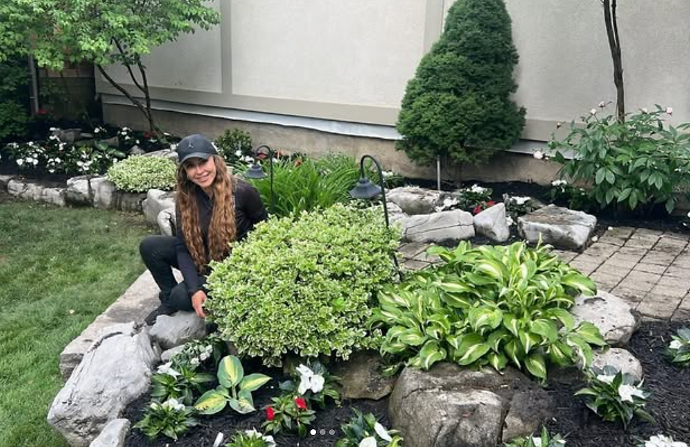 Woman in a high end garden design