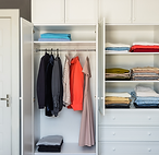 modern-dressing-room-neatly-hung-clothes-hangers-shelves-closet 1.png