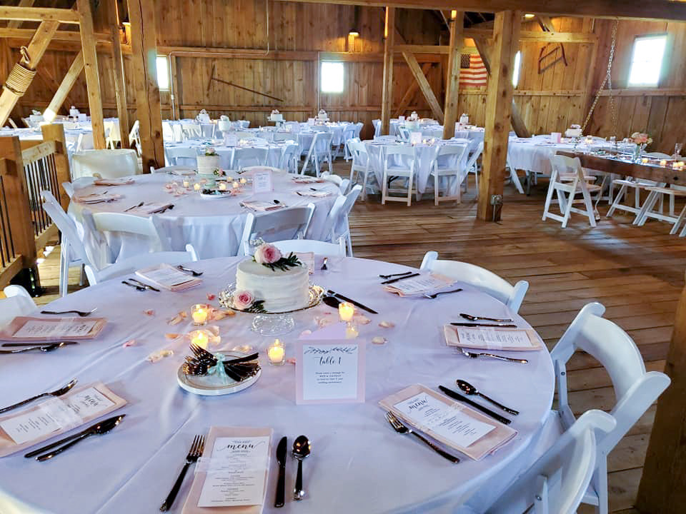 Barn wedding reception setup at The Barn at Double K Ranch